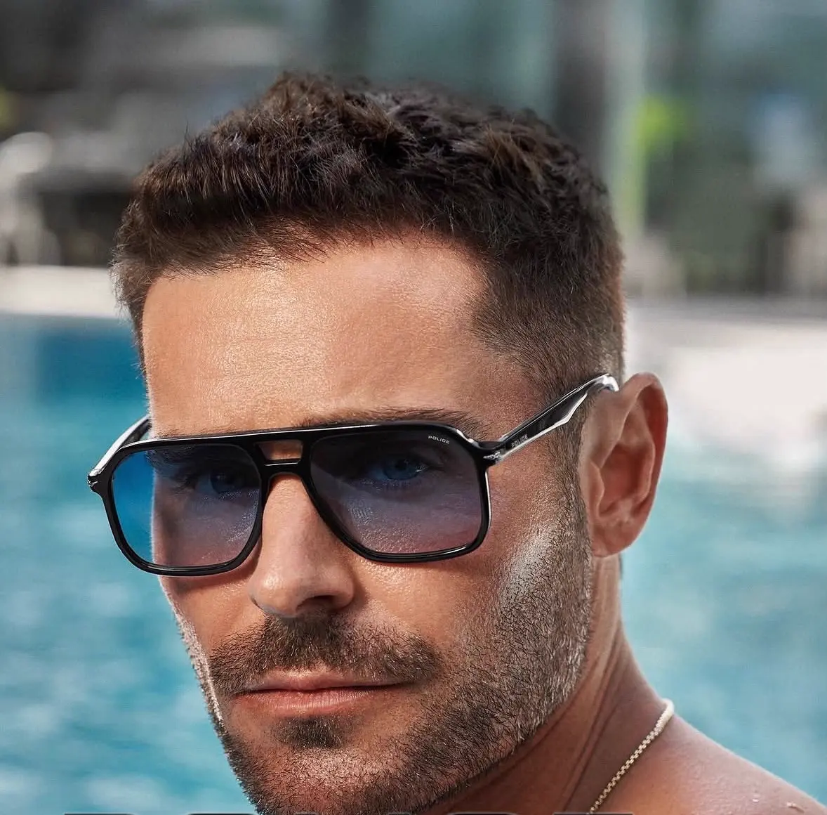 Model wearing Police sunglasses